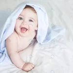 newborn toddler boy laughing bed crcca81e220 size6.02mb 5458x3639 - title:Home - اورچین فایل - format: - sku: - keywords:وکتور,موکاپ,افکت متنی,پروژه افترافکت p_id:63922