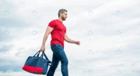 active man walking with sporty bag sky background rnd540 frp30628931 - title:Home Main - اورچین فایل - format: - sku: - keywords: p_id:18