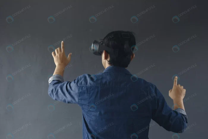 back view young man casual style wearing virtual crc8a390133 - title:عکس پسر جوان با عینک واقعیت مجازی - اورچین فایل - format:JPG - استوک - sku:crc8a390133 - keywords: p_id:63187