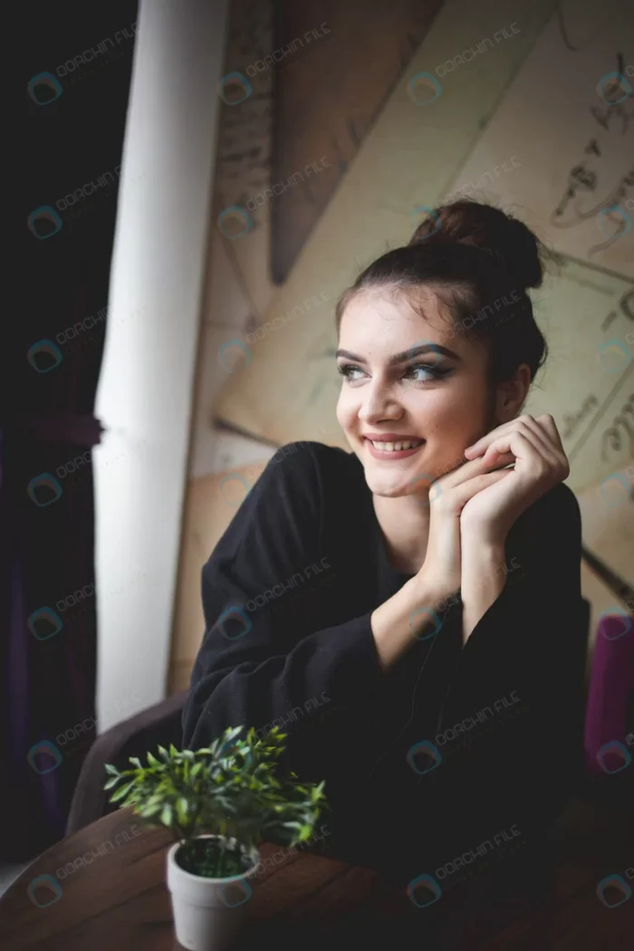 beautiful bosnian woman sitting cafe looking out crc7051cdc0 size2.46mb 3266x4899 1 - title:تصویر دختر خندان نشسته در کافی شاپ - اورچین فایل - format:JPG - استوک - sku:crc7051cdc0 - keywords: p_id:51280