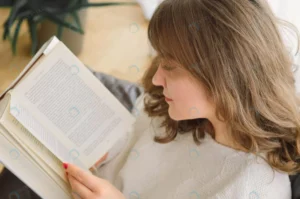 beauty young woman is reading book home crc9b447930 size8.8mb 4912x3264 1 - title:Home - اورچین فایل - format: - sku: - keywords: p_id:18