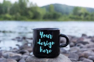 black campfire mug mockup with stony river bank.j crc6d8a9c42 size86.62mb 1 - title:Home - اورچین فایل - format: - sku: - keywords: p_id:18