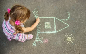 child draws house with chalk asphalt selective fo crc44e42595 size12.10mb 4632x2916 - title:Home - اورچین فایل - format: - sku: - keywords: p_id:18