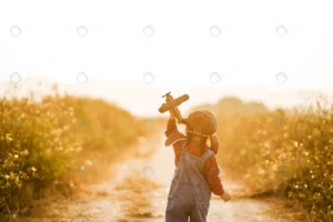 child with toy airplane nature sunset crc820c3053 size12.95mb 5472x3648 - title:Home - اورچین فایل - format: - sku: - keywords: p_id:18