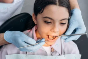 closeup view dentist examines teeth little girl w crc02af249f size18.18mb 7952x5304 - title:Home - اورچین فایل - format: - sku: - keywords: p_id:18