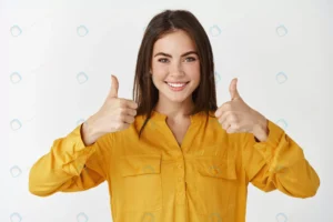 confident young woman showing thumbs up smiling p crc3b794192 size14.67mb 7000x4667 - title:Home - اورچین فایل - format: - sku: - keywords: p_id:18