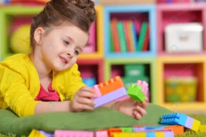 curly little girl playing with colorful plastic b crcff9cdf99 size6.85mb 4928x3280 - title:Home - اورچین فایل - format: - sku: - keywords: p_id:18