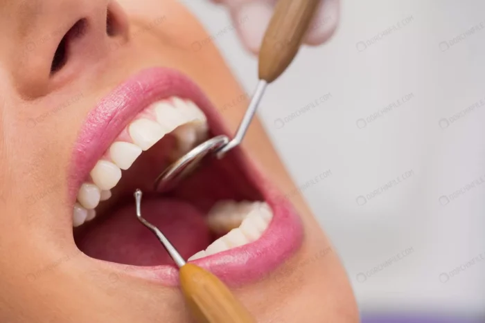 dentist examining female patient teeth crcdce1525d - title:تصویر معاینه دندان خانم - اورچین فایل - format:JPG - استوک - sku:crcdce1525d - keywords: p_id:91991