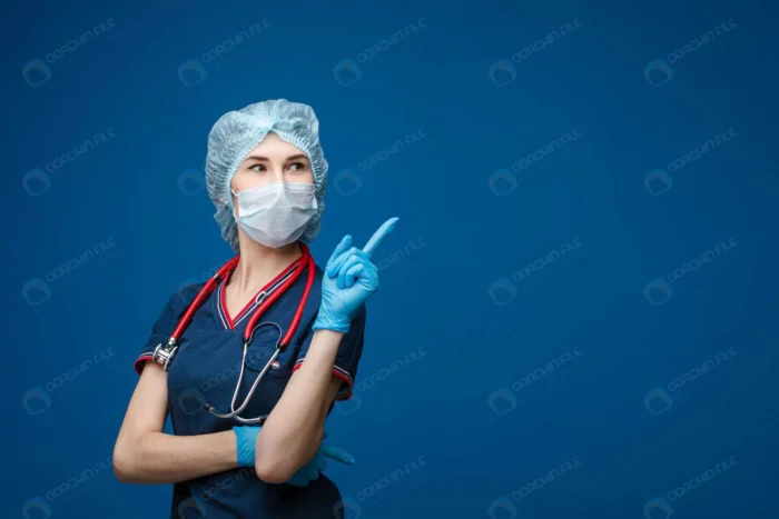 doctor uniform pointing blank space crcf58f9f15 - title:عکس استوک پزشک زن با موضوع کرونا - اورچین فایل - format:JPG - استوک - sku:crcf58f9f15 - keywords: p_id:35475