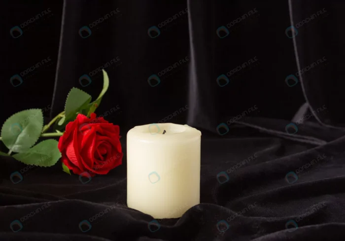 extinguished candle red rose black background crc06b1ec45 - title:گل رز و شمع با پس زمینه مشکی - اورچین فایل - format:JPG - استوک - sku:crc06b1ec45 - keywords: p_id:88943