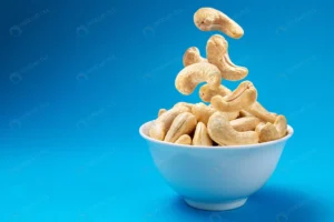 falling cashew nuts into bowl blue background wit crcab3a4db9 size10.95mb 5000x3342 - title:Home - اورچین فایل - format: - sku: - keywords: p_id:18