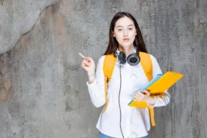 female student with backpack headphones pointing crc2e441d61 size14.46mb 6720x4480 - title:Home - اورچین فایل - format: - sku: - keywords: p_id:18