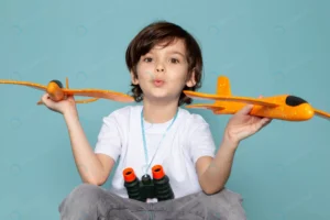 front view cute boy holding orange toy planes whi crc1eb76eb5 size7.94mb 5472x3648 - title:Home - اورچین فایل - format: - sku: - keywords: p_id:18