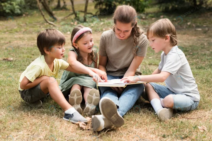 full shot teacher kids holding book crc5b3ddd27 - title:معلم و دانش آموزان در حال تماشای کتاب - اورچین فایل - format:JPG - استوک - sku:crc5b3ddd27 - keywords: p_id:91045