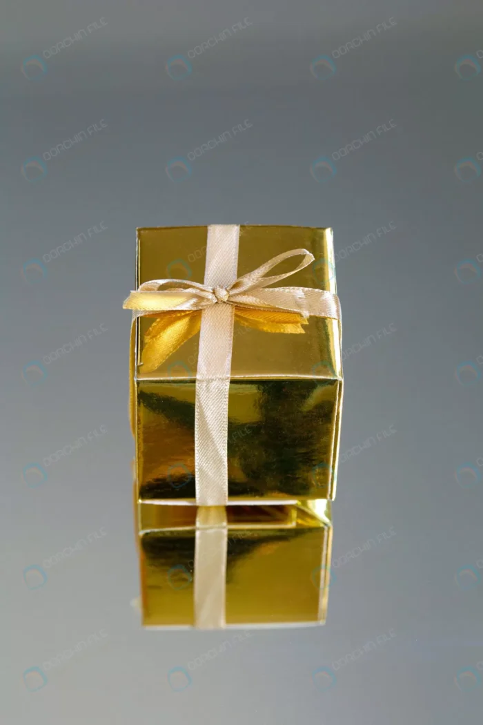 golden gift box with gold ribbon bow birthday chr crc98785e67 - title:تصویر استوک جعبه کادو طلایی - اورچین فایل - format:JPG - استوک - sku:crc98785e67 - keywords:تصویر استوک جعبه کادو طلایی, عکس استوک, تصویر استوک رایگان, دانلود رایگان, فایل تکی, هدیه p_id:52774
