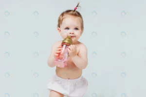 happy girl diaper with cute hairstyle holds bottl crc901905b2 size5.93mb 6235x4157 - title:Home - اورچین فایل - format: - sku: - keywords: p_id:18