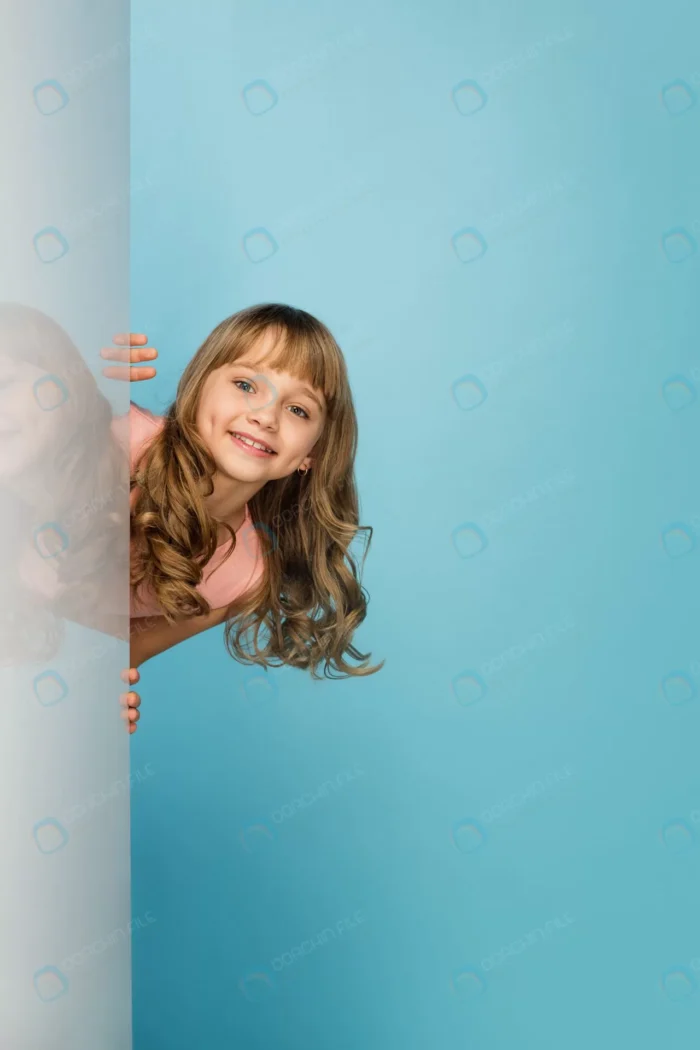 happy girl isolated blue studio wall crcbeb579d6 - title:تصویر دختر با موهای بلند - اورچین فایل - format:JPG - استوک - sku:crcbeb579d6 - keywords: p_id:90495