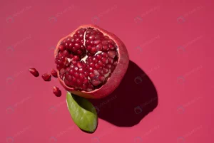 juicy cut pomegranate red background with hard sh crca850b60a size3.48mb 4974x3328 - title:Home - اورچین فایل - format: - sku: - keywords: p_id:18