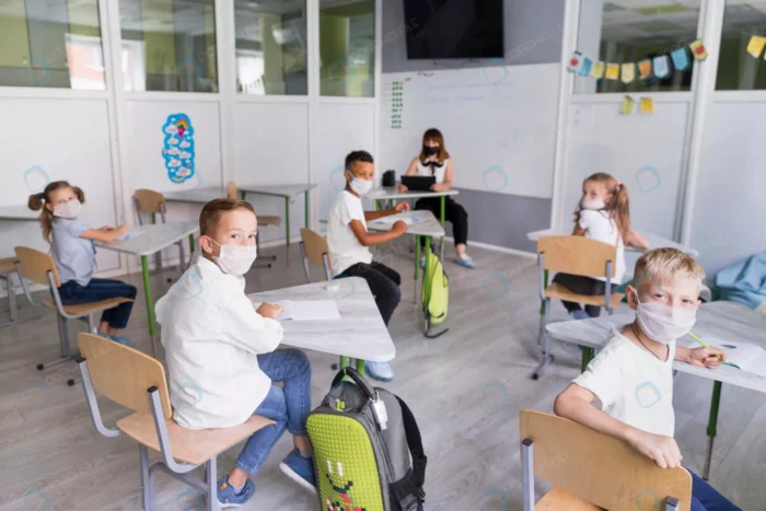 kids teacher wearing medical masks during pandemi crc13253b41 - title:عکس استوک امتحانات در دوران پاندمی - اورچین فایل - format:JPG - استوک - sku:crc13253b41 - keywords: p_id:39973