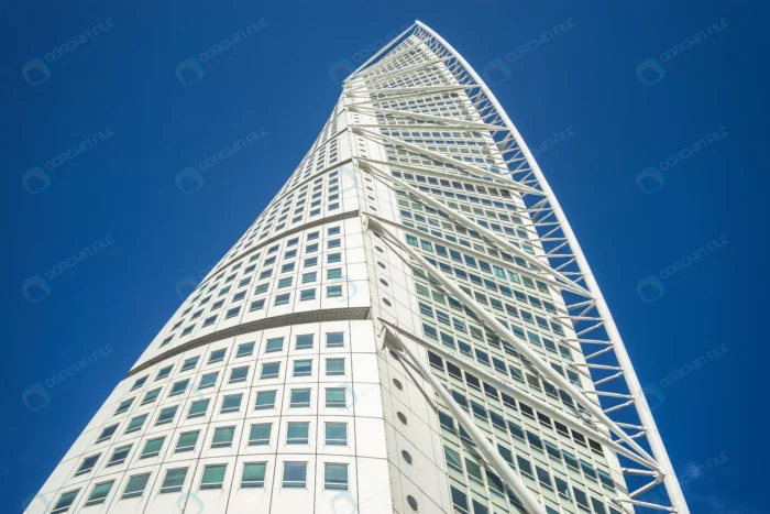 low angle view turning torso blue sky sunlight ma crc1e8c38f2 - title:تصویر استوک معماری آسمان خراش از نمای پایین - اورچین فایل - format:JPG - استوک - sku:crc1e8c38f2 - keywords: p_id:62189