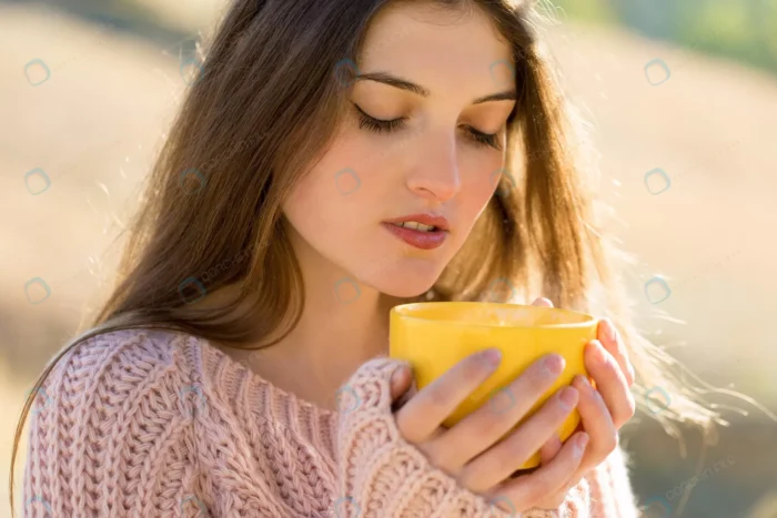 portrait pretty young woman stylish knitted sweat crcb28e29c0 - title:استوک خانم با فنجان قهوه زرد رنگ - اورچین فایل - format:JPG - استوک - sku:crcb28e29c0 - keywords: p_id:77909