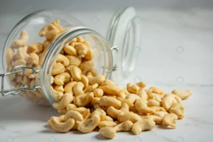 raw cashews nuts open glass jar marble background crc943ebdd2 size8.11mb 5760x3840 - title:Home - اورچین فایل - format: - sku: - keywords: p_id:18