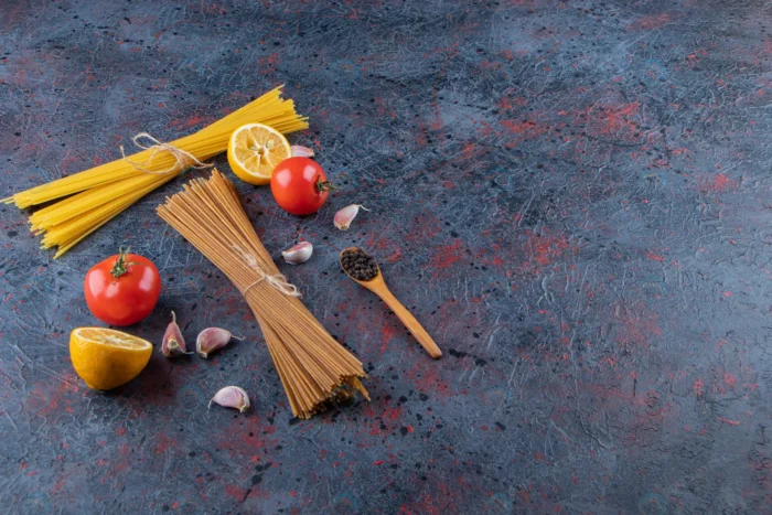 raw noodles with fresh red tomatoes garlic dark b crc90417343 - title:استوک ماکارونی با گوجه فرنگی - اورچین فایل - format:JPG - استوک - sku:crc90417343 - keywords: p_id:80653
