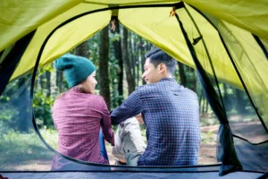 rear view asian couple relaxing outside tent crce857794a size26.47mb 7360x4912 - title:Home - اورچین فایل - format: - sku: - keywords: p_id:18