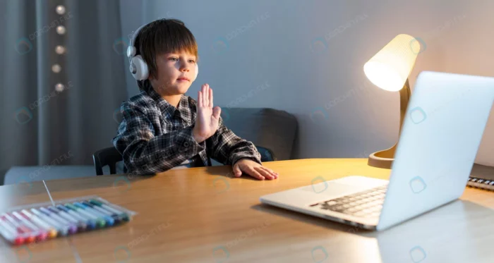 school boy taking online courses waving crc20583274 - title:استوک کلاس مجازی در دوران کرونا - اورچین فایل - format:JPG - استوک - sku:crc20583274 - keywords: p_id:38089