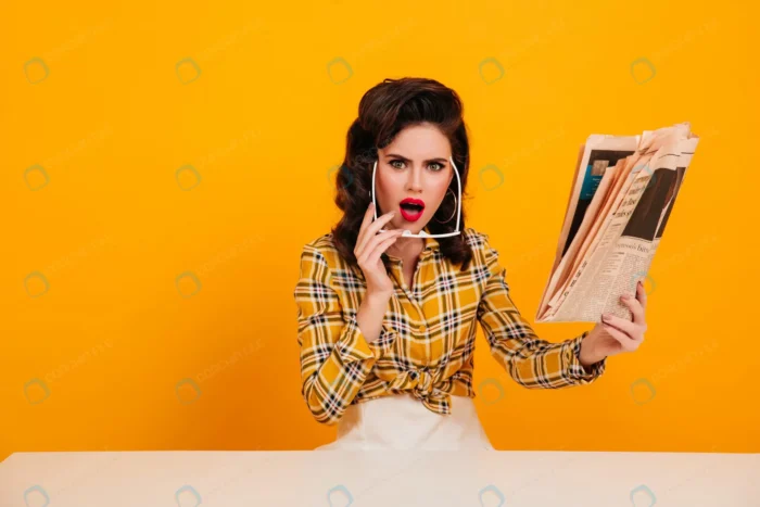 shocked woman sunglasses posing with newspaper st crcfa4a8c44 - title:تصویر دختر متعجب از مطالب روزنامه - اورچین فایل - format:JPG - استوک - sku:crcfa4a8c44 - keywords: p_id:90773