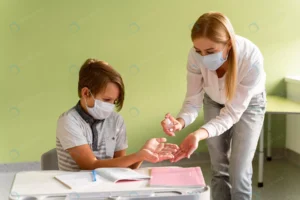 teacher with medical mask disinfecting child s ha crccc54ed52 size5.40mb 7952x5304 - title:Home - اورچین فایل - format: - sku: - keywords: p_id:18