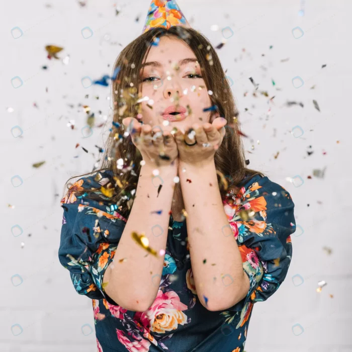 teenage girl blowing confetti from hand against w crcc4f8a875 size10.22mb 4912x4912 1 - title:عکس باکیفیت دختر با کنفتی - اورچین فایل - format:JPG - استوک - sku:crcc4f8a875 - keywords: p_id:46307