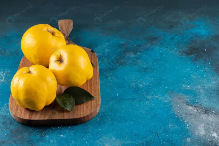 three yellow quince fruits placed wooden board crcbe71f83e size15.13mb 6000x4000 1 - title:عکس استوک میوه بِه - اورچین فایل - format:JPG - استوک - sku:crcbe71f83e - keywords: p_id:45159