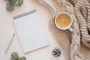 top view of notebook with coffee and sweater crc2e080a0f size74.45mb - title:Home - اورچین فایل - format: - sku: - keywords: p_id:18