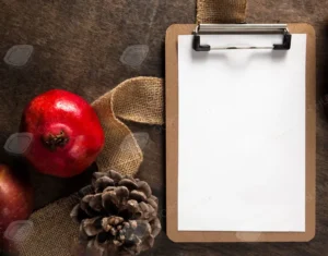 top view of notepad with autumn pomegranate and pine cones - title:Home - اورچین فایل - format: - sku: - keywords: p_id:18