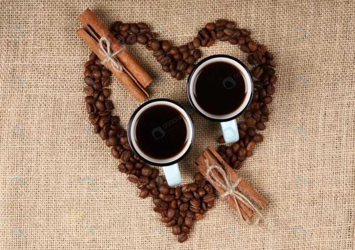 two blue cups coffee inside heart shaped coffee b crc435c9fc4 - title:عکس فنجان قهوه از نمای تاپ - اورچین فایل - format:JPG - استوک - sku:crc435c9fc4 - keywords: p_id:62252