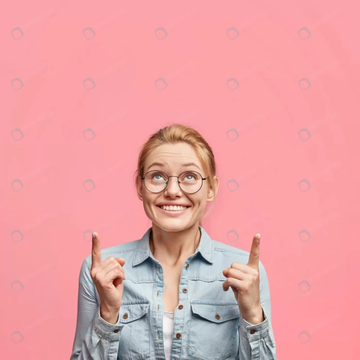 vertical shot of delighted pretty blonde young wo crcf2db2311 - title:عکس دختر در حال اشاره به بالا - اورچین فایل - format:JPG - استوک - sku:crcf2db2311 - keywords: p_id:90817