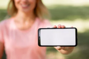 woman showing a phone with a mock up screen outdo crc92dfdf2b size138.27mb - title:Home - اورچین فایل - format: - sku: - keywords: p_id:18