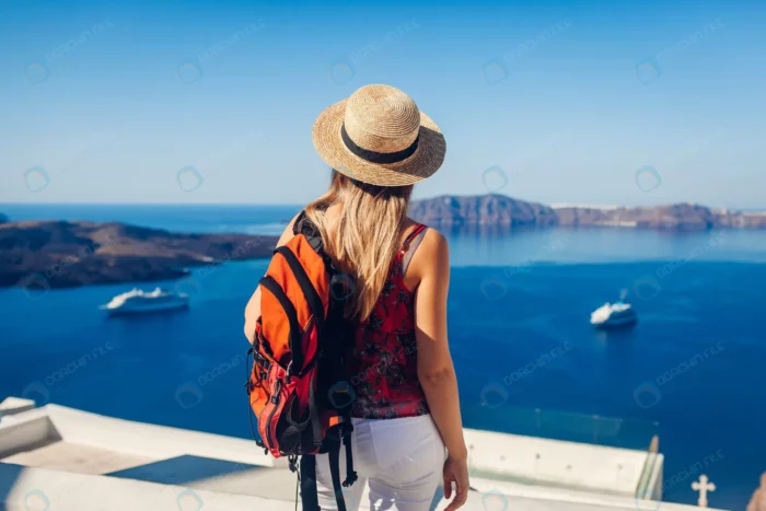 woman traveler looking caldera from fira thera san rnd764 frp6483955 - title:دختر با کلاه حصیری و کوله پشتی کنار دریا - اورچین فایل - format:JPG - استوک - sku:frp6483955 - keywords: p_id:72467