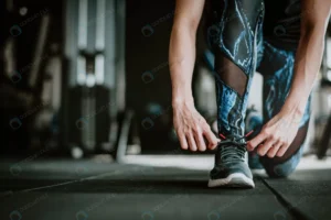 woman tying her shoelaces before exercise rnd650 frp2556356 - title:Home - اورچین فایل - format: - sku: - keywords: p_id:18