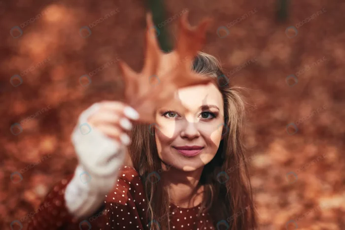 woman with leaf shadow face autumn forest crc5be44962 - title:عکس با کیفیت دختر جوان با برگ پاییزی - اورچین فایل - format:JPG - استوک - sku:crc5be44962 - keywords: p_id:63159