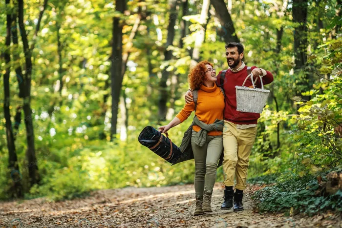 young happy couple walking nature crc0044f77e - title:زوج جوان با لوازم پیک نیک در جنگل - اورچین فایل - format:JPG - استوک - sku:crc0044f77e - keywords: p_id:63429