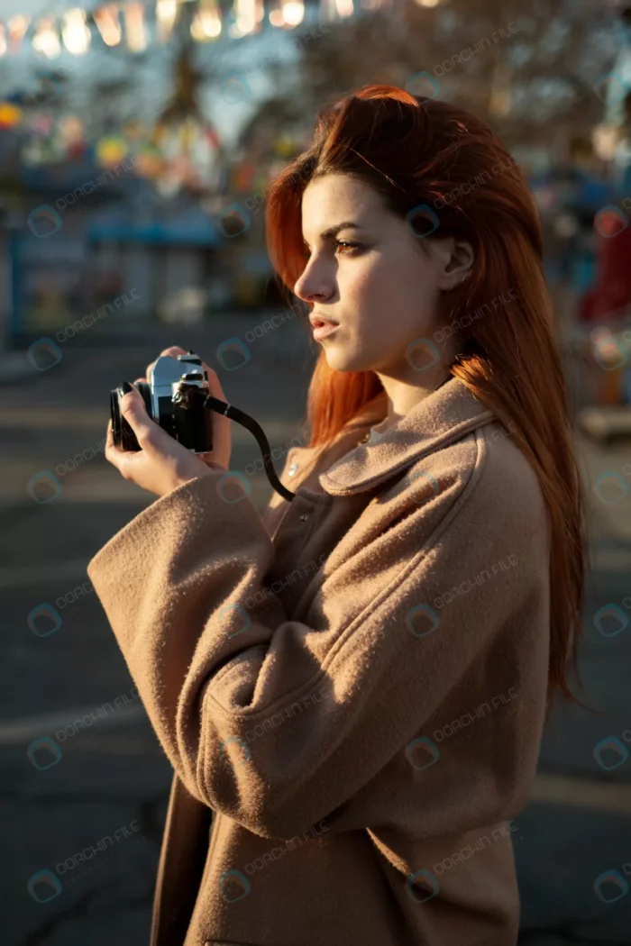 young woman taking photos crc2fcc3e1e - title:استوک عکاس خانم با دوربین - اورچین فایل - format:JPG - استوک - sku:crc2fcc3e1e - keywords: p_id:51753