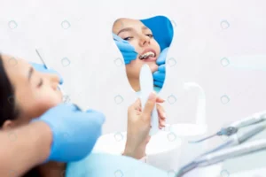 young women checks her teeth mirror new dental im crc5b0b57c4 size4.61mb 4550x3033 - title:Home - اورچین فایل - format: - sku: - keywords: p_id:18